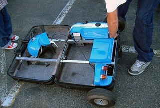Illustration for article titled It's a Go-Kart That Folds Into a Suitcase. Any Questions?